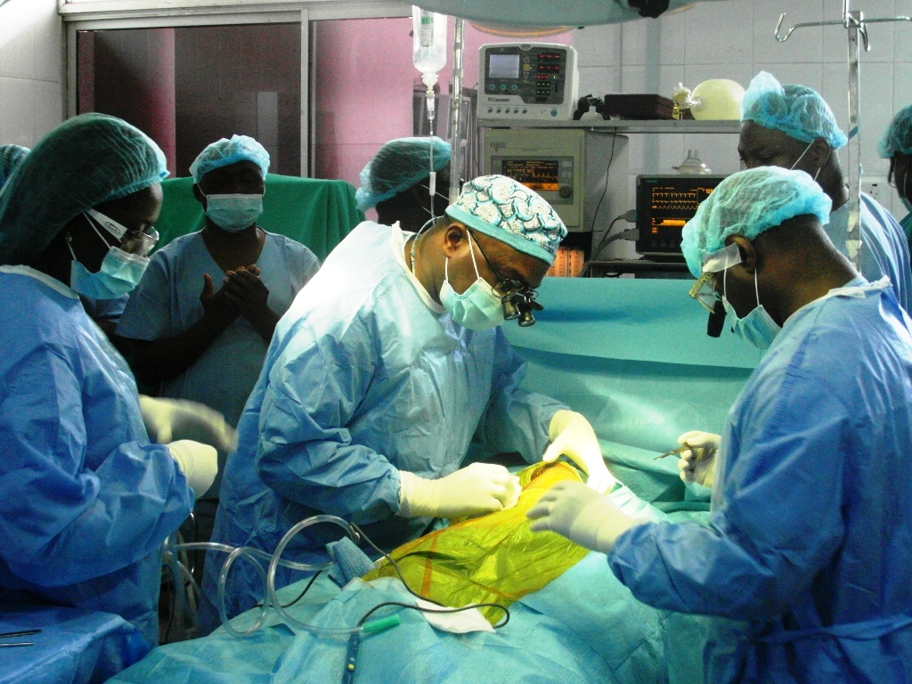 Joanna under the knife as Garki Hospital surgeons work to correct her heart condition.
