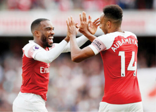 Arsenal key strikers, Alexandre Lacazette (L) and Pierre-Emerick Aubameyang celebrate after scoring a goal