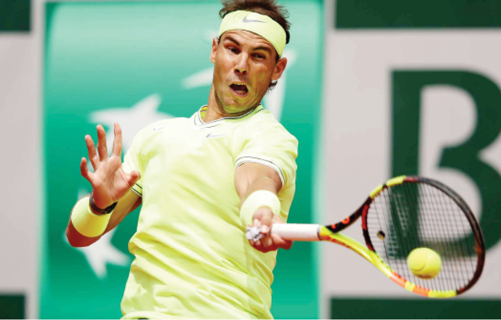 Rafael Nadal returns a serve during a match in the 2019 French Open
