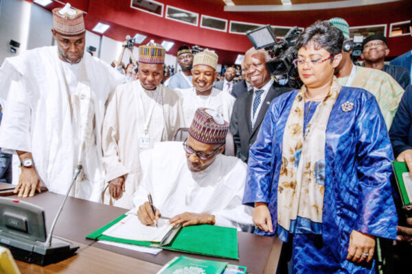 President Muhammadu Buhari signs an agreement establishing the African Continental Free Trade Area, AfCFTA, during the opening of the 12th Extra Ordinary Session of the Assembly of African Union Heads of State and Government in Niamey, Niger Republic yesterday