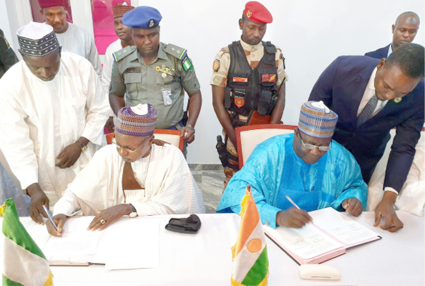 Governor Aminu Bello Masari of Katsina State (left) with Maradi Prefecture of Niger Republic, Alh. Zakari Umaru, during the signing of a communique at the end of their meeting on trans-border banditry in Maradi, Niger Republic yesterday. The governors of Sokoto and Zamfara States also signed the communique
