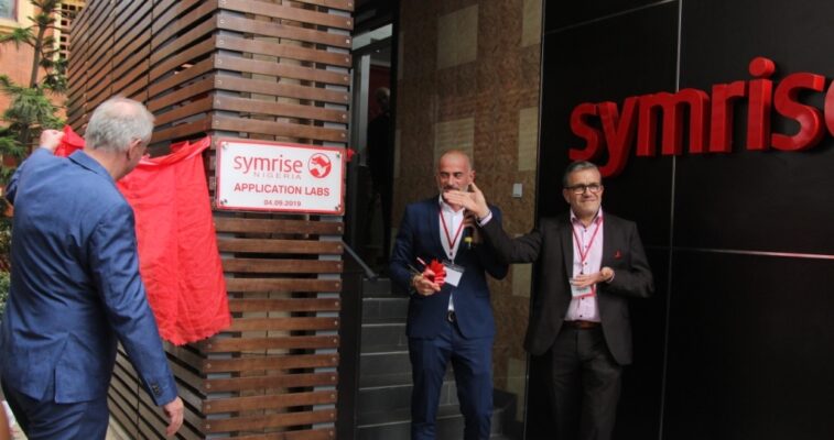 Thomas Dressler, President EAME Fragrances and Oral care, Alexander Lichter, Vice President Flavour Sales EAME and Daniel Ibarra, Vice President EAME Cosmetic Ingredients Division cutting the ribbon during the official opening of Symrise Laboratories Facility in Lagos.
