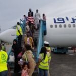 Some of the Nigerians who returned from Libya on Thursday, disembarking from the aircraft at the MMIA, Lagos. PHOTO BY: Abdullateef Aliyu.