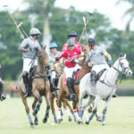 SD Farm polo team patron, Sayyu Dantata of Nigeria ( second right) looks over his shoulder after breaking through on his way to winning the Palm Beach Open title last year. Dantata’s champ
