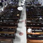 Worshippers sit in an almost empty auditorium of the Methodist Church of Trinity, Tinubu in compliance to government restriction on social gatherings in Lagos, on March 22, 2020. - Nigeria, the most populated country in Africa, on March 21, 2020 tightened restrictions in three states on places of worship, airports and bars to try and protect its population against the new COVID-19 coronavirus. In Lagos state, Abuja and Ogun, churches, mosques, social gatherings, football viewing centres and night clubs must restrict attendance to 50 people, according to new regulations drawn up by the Presidential Task Force on COVID-19 coronavirus. (Photo by PIUS UTOMI EKPEI / AFP)