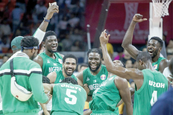 Member of Nigeria’s male senior basketball team, D’Tigers celebrating after a victorious outing.