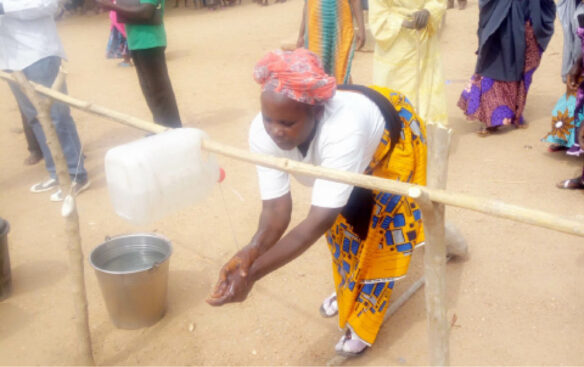 Plateau women rig up hand-washing device