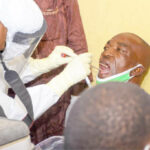 A health worker takes sample for the COVID-19 test in Kano recently