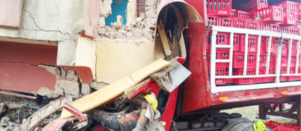 Victims trapped under the rubbles of a building after a truck crashed into the place at Madalla in Niger State on Saturday. Both victims were later rescued Photo: Adam Umar