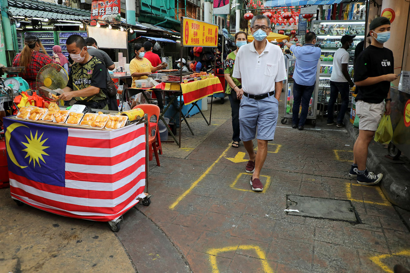 Malaysia bans arrivals from countries with more than 150,000 virus cases