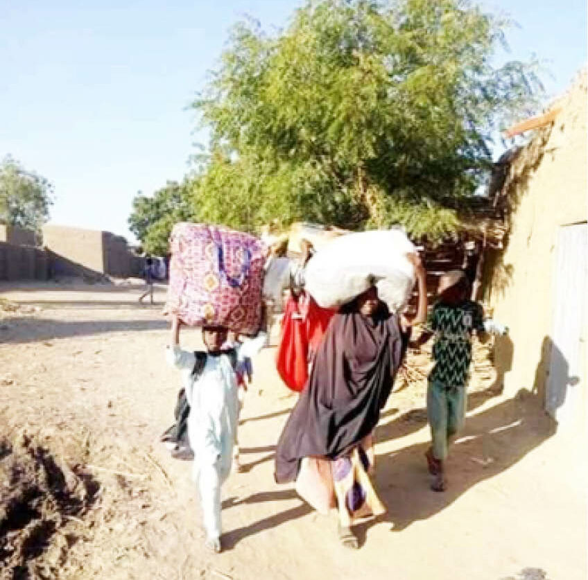 Villagers fleeing Garin Mallam after an attack by suspected herders