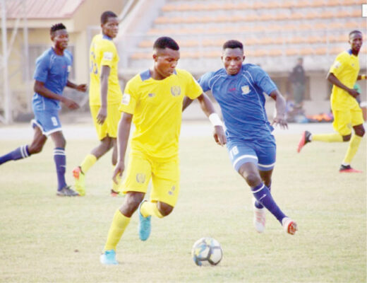 L-R: Jigawa Stars’ Richard Christopher drives the ball away from Sunshine Stars’ Sunday Abe during the Match Day 1 of the 2020/2021 NPFL season.