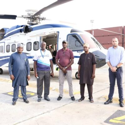 Officials of NPA, Caverton and PMTL Terminal shortly before the assembled Caverton helicopter was flown.