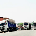 Trucks loaded with grains travelling towards Jalingo-Gombe Road avoiding Jalingo-Benue Road.