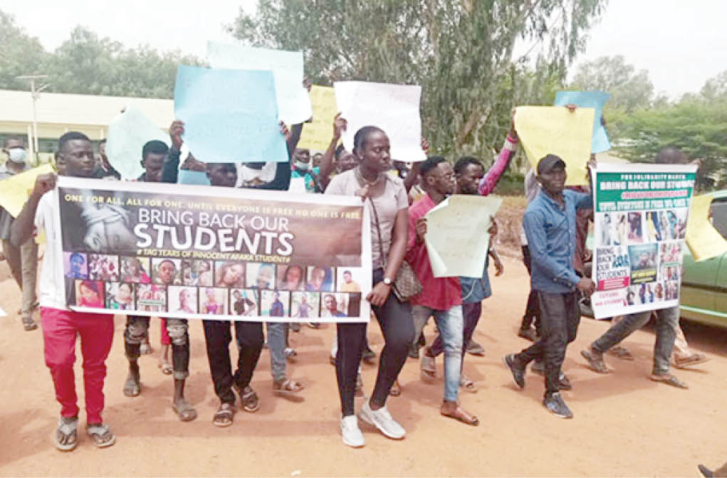 Students of the Federal College of Forestry Mechanization Afaka, protesting at the gate of the school over the kidnap of their school mates Afaka, Igabi LGA of Kaduna State on Thursday Photo: NAN