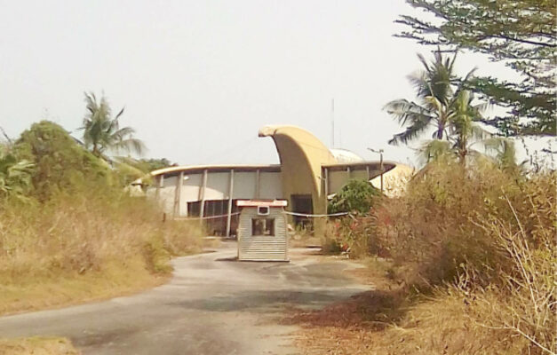 Side view of the Tinapa Nollywood studio as well as the water park overtaken by bush