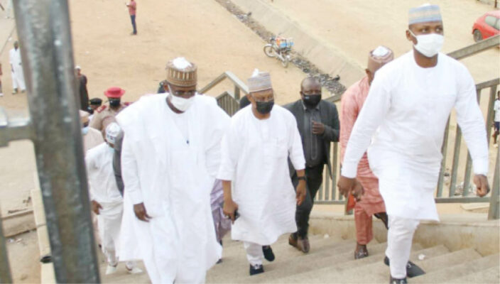 FCT Minister, Malam Muhammad Musa Bello, (1st left), Executive secretary FCDA, Engr Umar Gambo Jibrin (2nd left) and other oficials of the FCTA during the minister's inspection of pedestrian bridges along the Airport Road over the weekend.