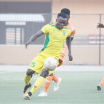 Katsina United attacking winger, Joseph Atule controls the ball under pressure from Dakkada FC players during their match in the first round of the 2021 NPFL season