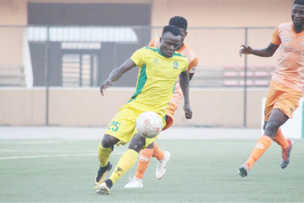 Katsina United attacking winger, Joseph Atule controls the ball under pressure from Dakkada FC players during their match in the first round of the 2021 NPFL season