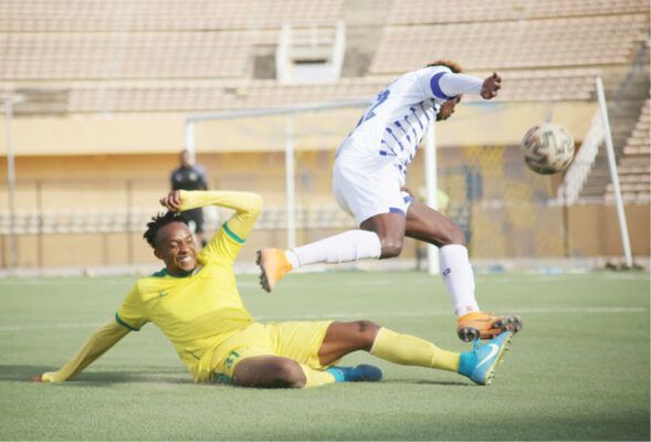 Ishaq Raffiu of Rivers United (R) evades a tackle from Katsina United’s Faisal Sani during their match in the first round of the 2021 NPFL season