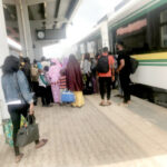 Passengers at Idu train station