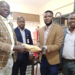 A former Super Eagles Coordinator, Emmanuel Attah, hands over cash donation to the FCT SWAN Chairman, Bunmi Haruna for SWAN Week