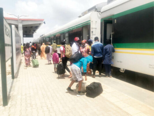 Passengers at Idu train station