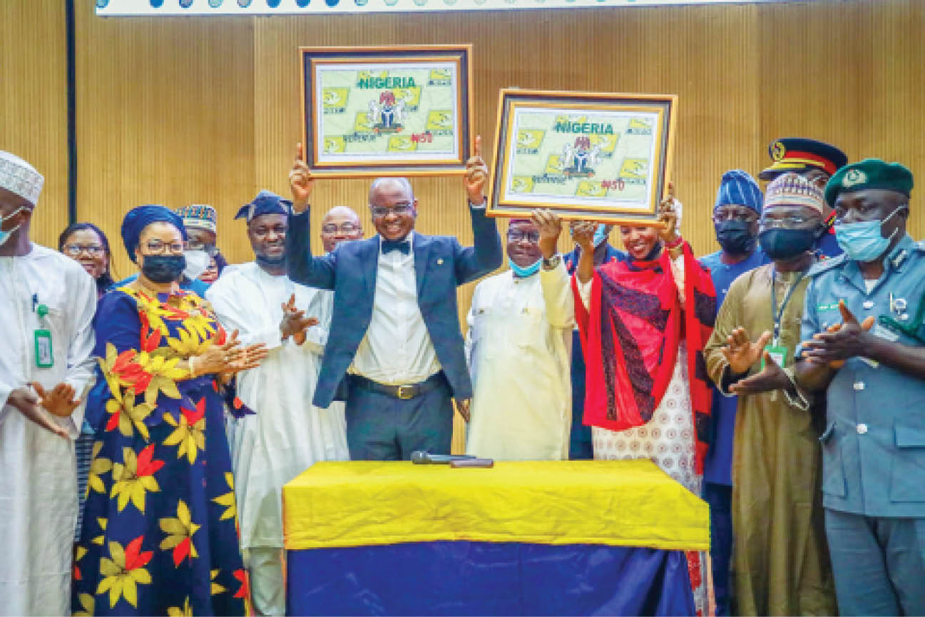 Minister of Communications and Digital Economy, Dr Isa Ali Ibrahim Pantami (3rd left) and other officials during the unveiling of Nigerian Postal Service (NIPOST) Revenue Stamp in Abuja on Tuesday