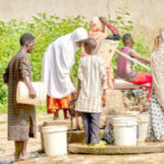 FILE PHOTO: Children fetching water from a borehole in Rano
