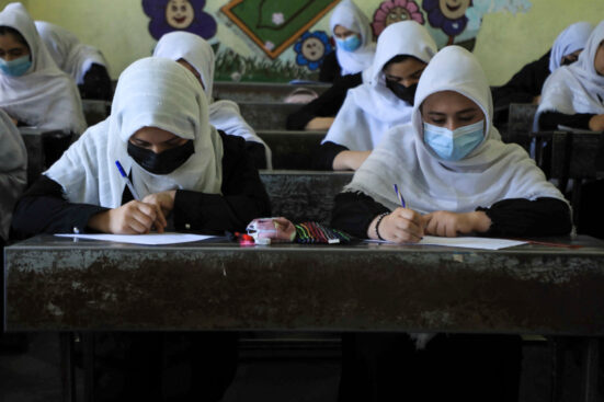 Schoolgirls attend class in Herat on August 17, 2021, following the Taliban stunning takeover of the country (Photo by AREF KARIMI / AFP)
