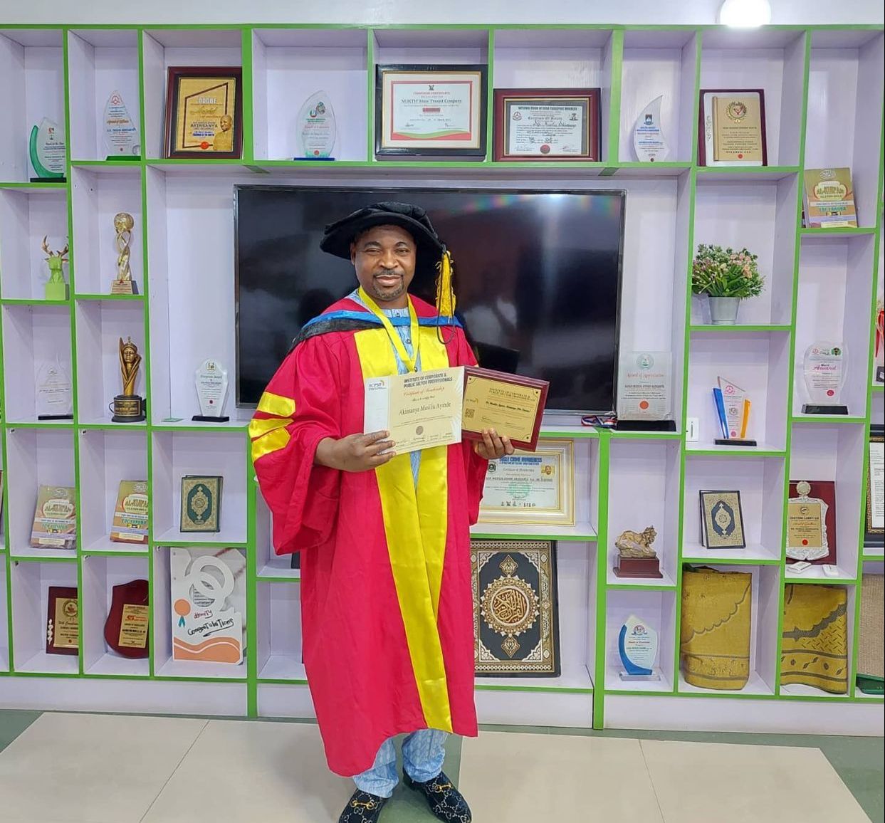 PHOTOS: MC Oluomo poses in academic gown as Institute ‘honours’ him