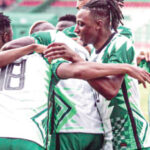 Super Eagles players celebrate after scoring a goal