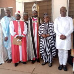 Moses Ayom in white caftan with the clergies and CP Ihagh