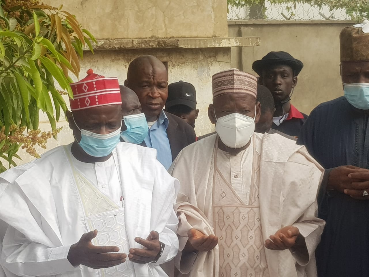 PHOTOS: Ganduje, Kwankwaso engage in heart-to-heart conversation over brother’s death