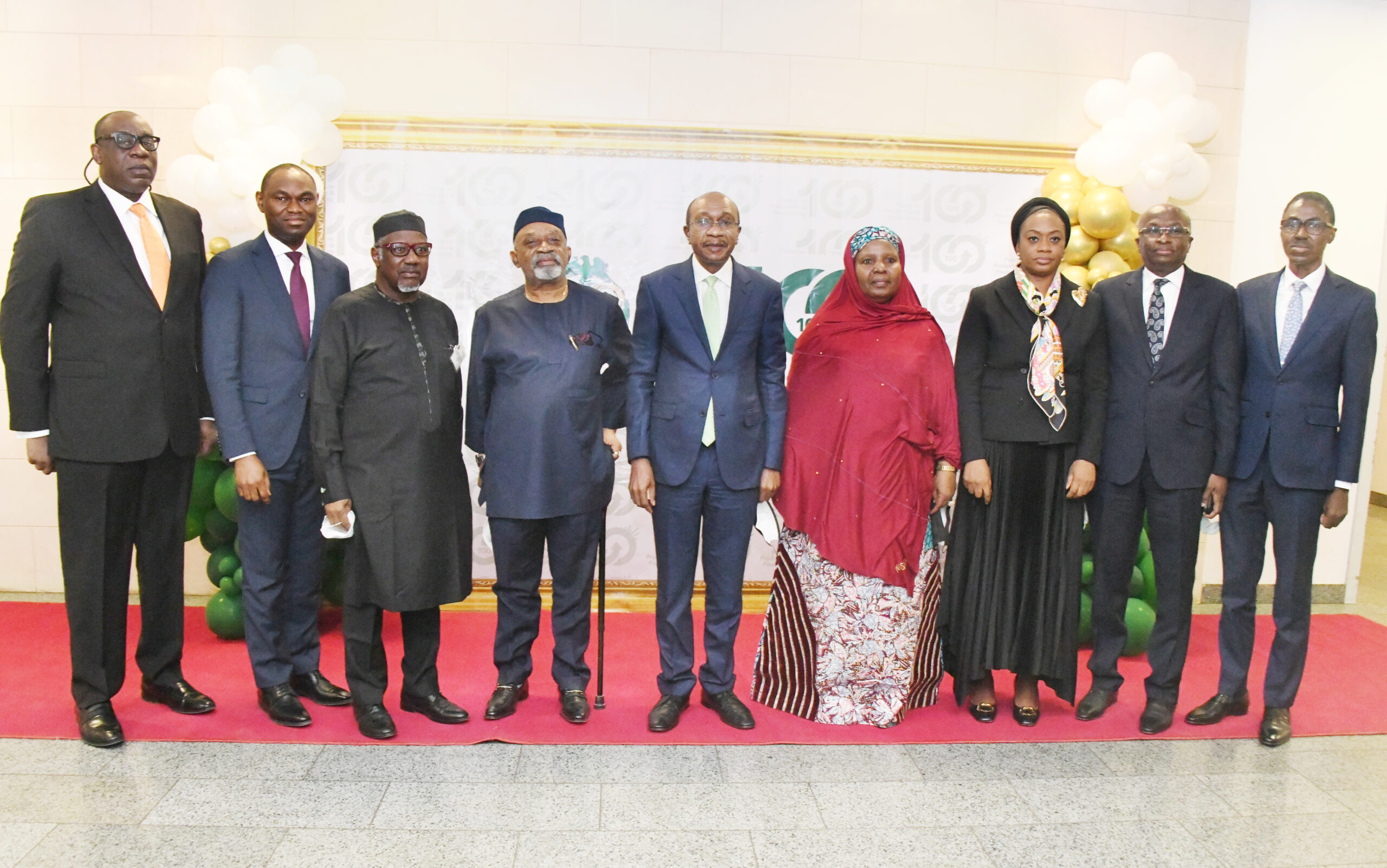 From left: Deputy Governor, Operations, Central Bank of Nigeria (CBN), Adebisi Osinubi; Deputy Governor, Economic Policy, CBN, Dr Kingsley Obiora: President MAN Dr Mansur Ahmed: Minister Labour and Productivity Dr Chris Ngige; Governor, CBN, Godwin Emefiele; Representative of the Secretary to the Federal Government, Dr Habiba Lawal; Deputy Governor, Finacial System Stability, CBN, Mrs Aishah Ahmad; Deputy Governor, Corporate Services, CBN, Edward Adamu and MD Nigeria Deposit Insurance Corporation (NDIC), Bello Hassan at the formal launch of the 100 for 100 Productive and Production Policy of the CBN in Abuja on Monday