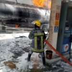 A firefighter battling with a fire outbreak at a filling station in Lagos recently