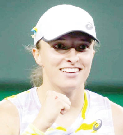 Swiatek holds off Andreescu to reach Indian Wells 4th round