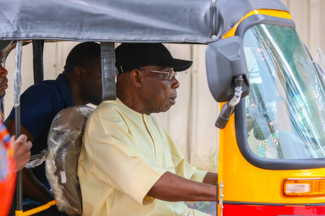 Drama as Obasanjo rides tricycle in Abeokuta, picks passenger