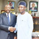 Minister of sports, Sunday Dare (L) and new NFF president, Alhaji Ibrahim Musa Gusau