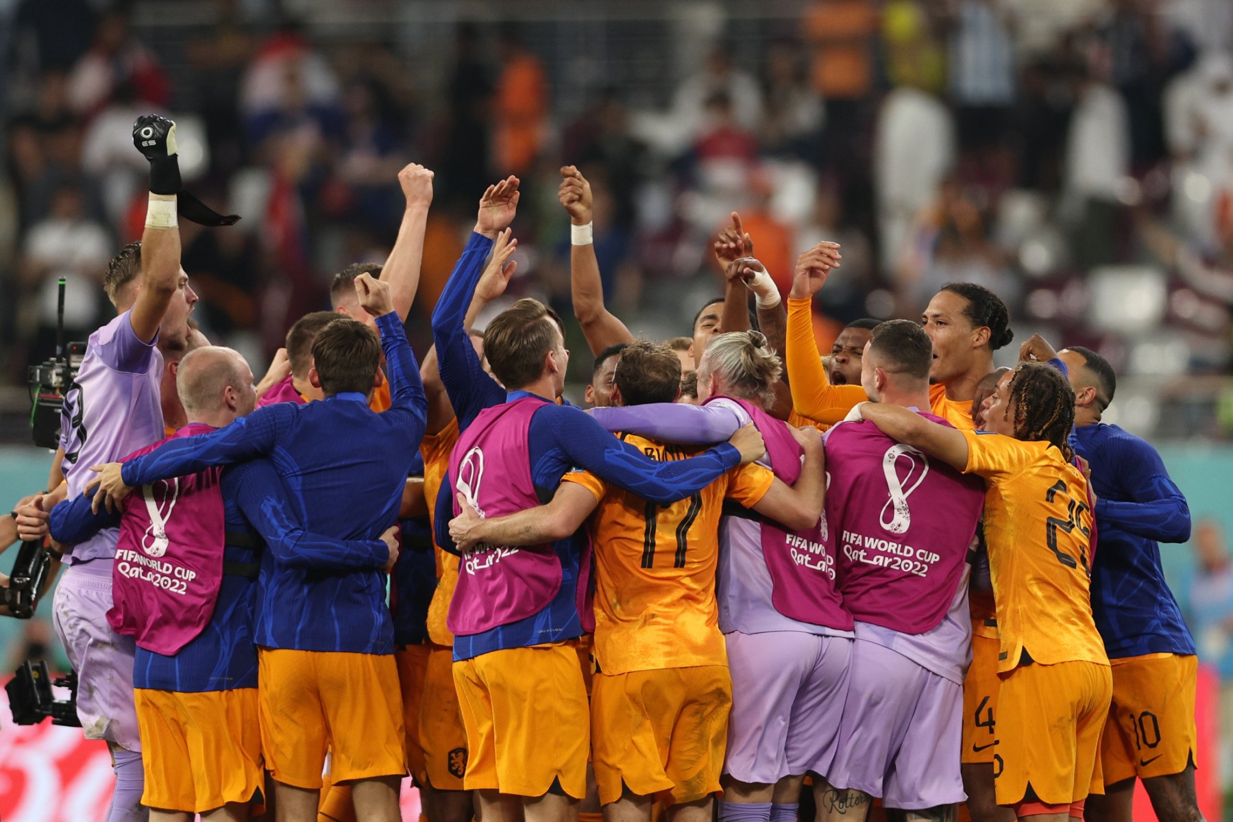Netherlands' players celebrate at the end of the Qatar 2022 World Cup round of 16 football match between the Netherlands and USA at Khalifa International Stadium in Doha on December 3, 2022. (Photo by Adrian DENNIS / AFP)