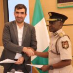 NIS Comtroller General, Mr Isah Jere Idris in a handshake with the CEO of the company, Dr Mohammad Darwish, after receiving the communication gadgets donation