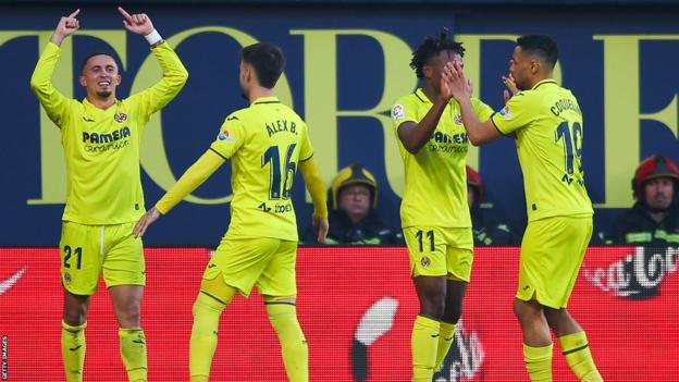 Samuel Chukwueze (11) and other Villarreal players celebrate one of their goals against Real Madrid