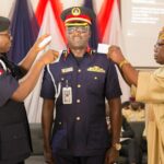 The NSCDC National PRO, Commandant Olusola Odumosu, being decorated with his new rank by his father, Mr Odumosu and the Commadant General of the Corps, Dr Ahmed Abubakar Audi