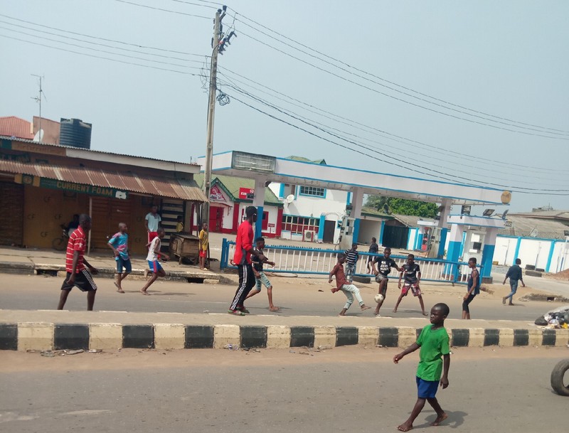 Naira crisis: Commuters stranded as protesters turn Lagos-Abeokuta Expressway to football pitch