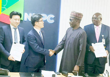 Group Chief Executive Officer of NNPC Ltd, Mele Kyari (2nd right) and the CEO of Daewoo Engineering & Construction Nigeria Ltd, Baek Jeong-wan (2nd left) with other officials at the signing ceremony at the NNPC Towers Abuja yesterday