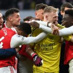 Saka celebrates with Arsenal teammates