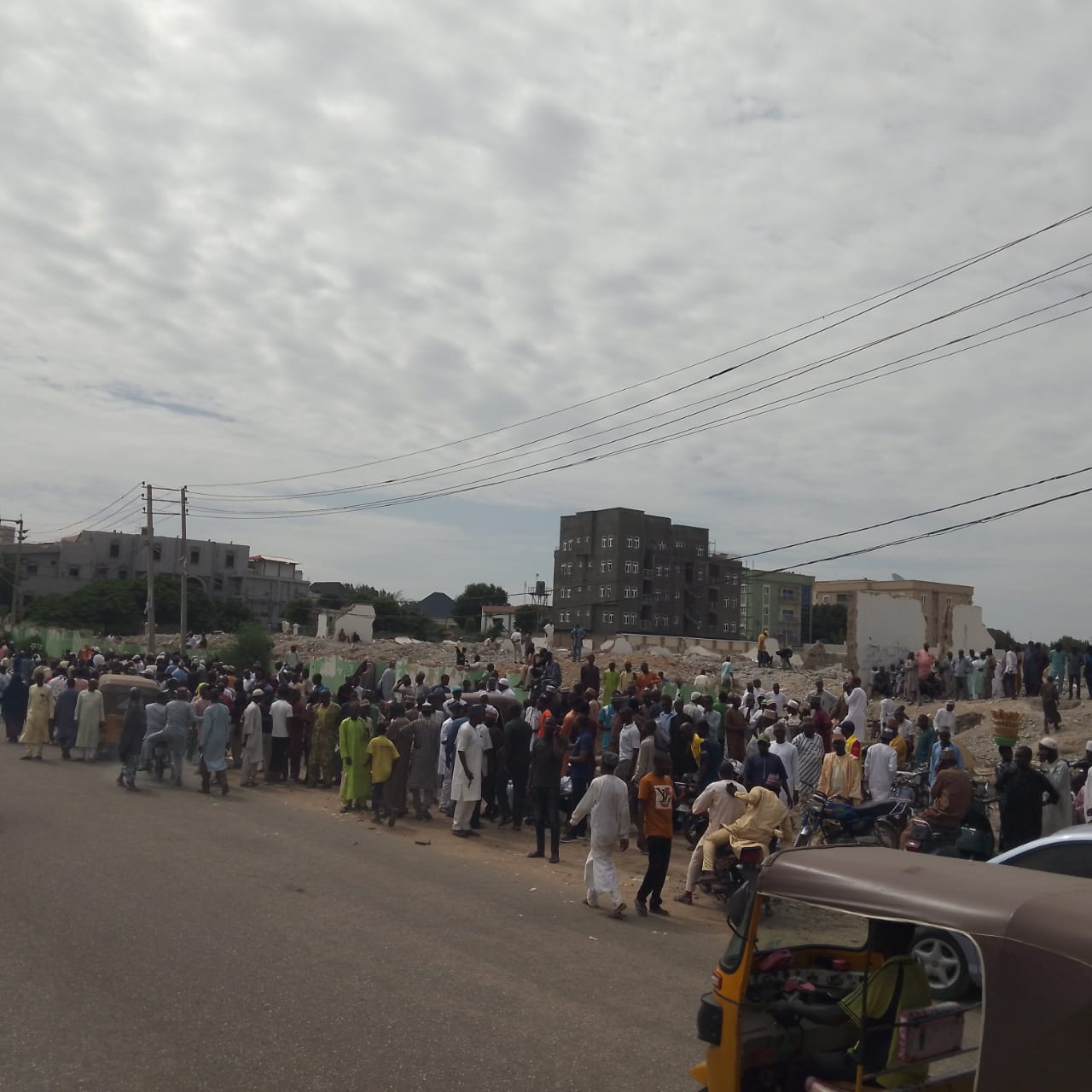 PHOTOS: APC supporters await Kano Tribunal judgement outside demolished Daula Hotel