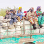 a truck conveying pasengers to ngala from chad