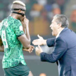 coach jose peseiro giving tactical instructions to victor osimhen during the 2023 africa cup of nations (afcon) in cote d’ivoire