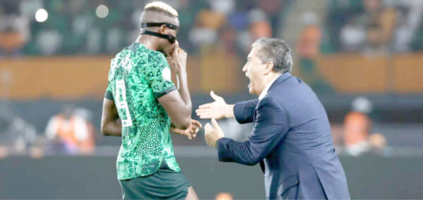 coach jose peseiro giving tactical instructions to victor osimhen during the 2023 africa cup of nations (afcon) in cote d’ivoire